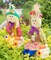 Set of 2 Garden Scarecrows Sitting on Hay Bale